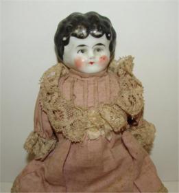 White-faced, glossy, porcelain doll - see the difference?